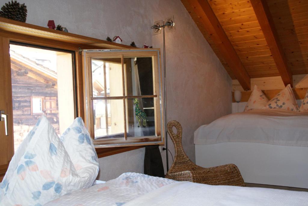 Postel nebo postele na pokoji v ubytování Chalet Lenzerheide-Sporz