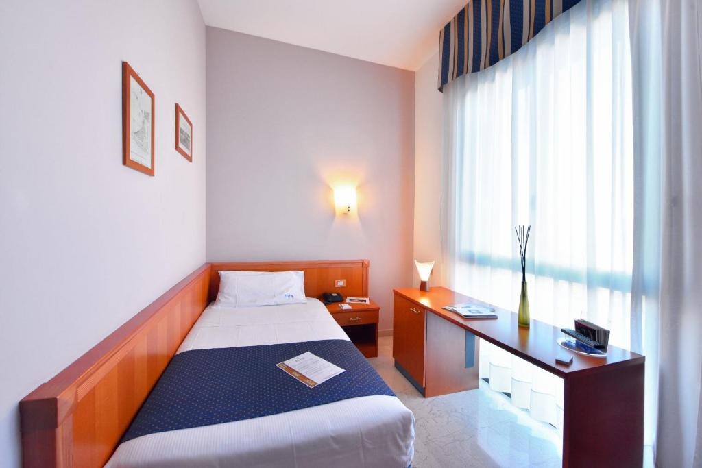 Postel nebo postele na pokoji v ubytování Hotel d'Altavilla