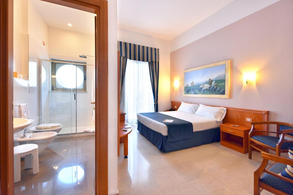 Postel nebo postele na pokoji v ubytování Hotel d'Altavilla