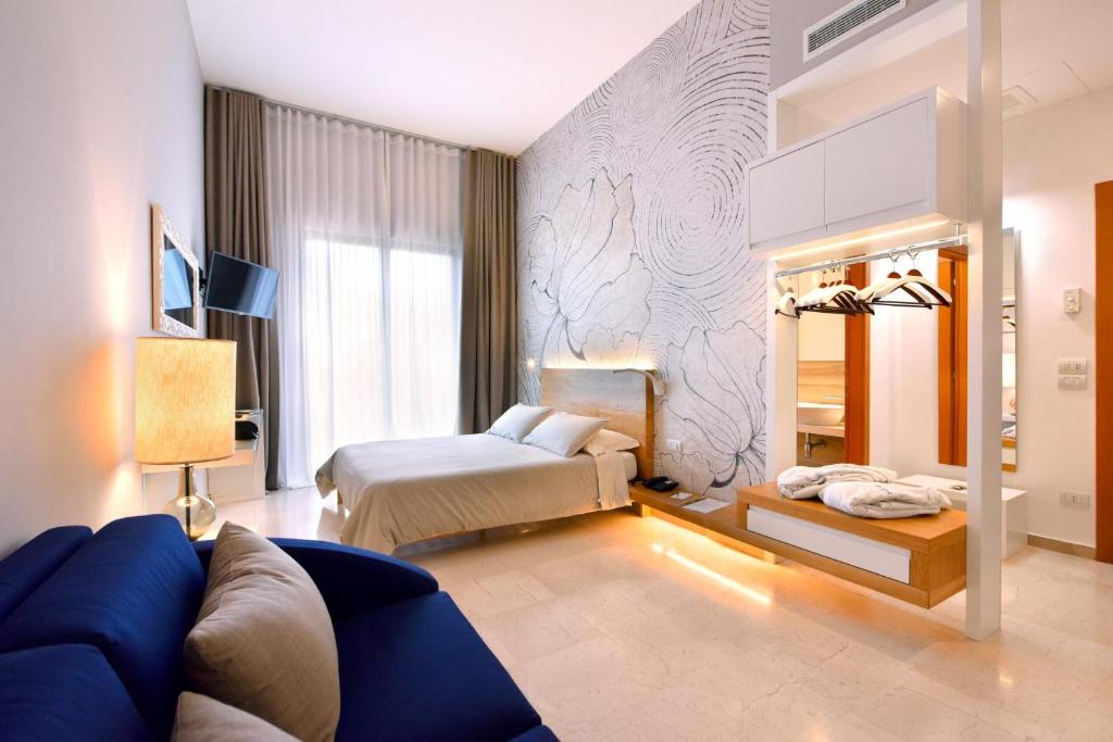 Postel nebo postele na pokoji v ubytování Hotel d'Altavilla