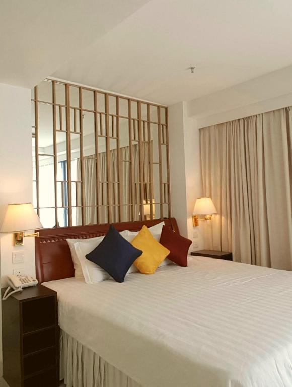Voodi või voodid majutusasutuse IW Hotel toas