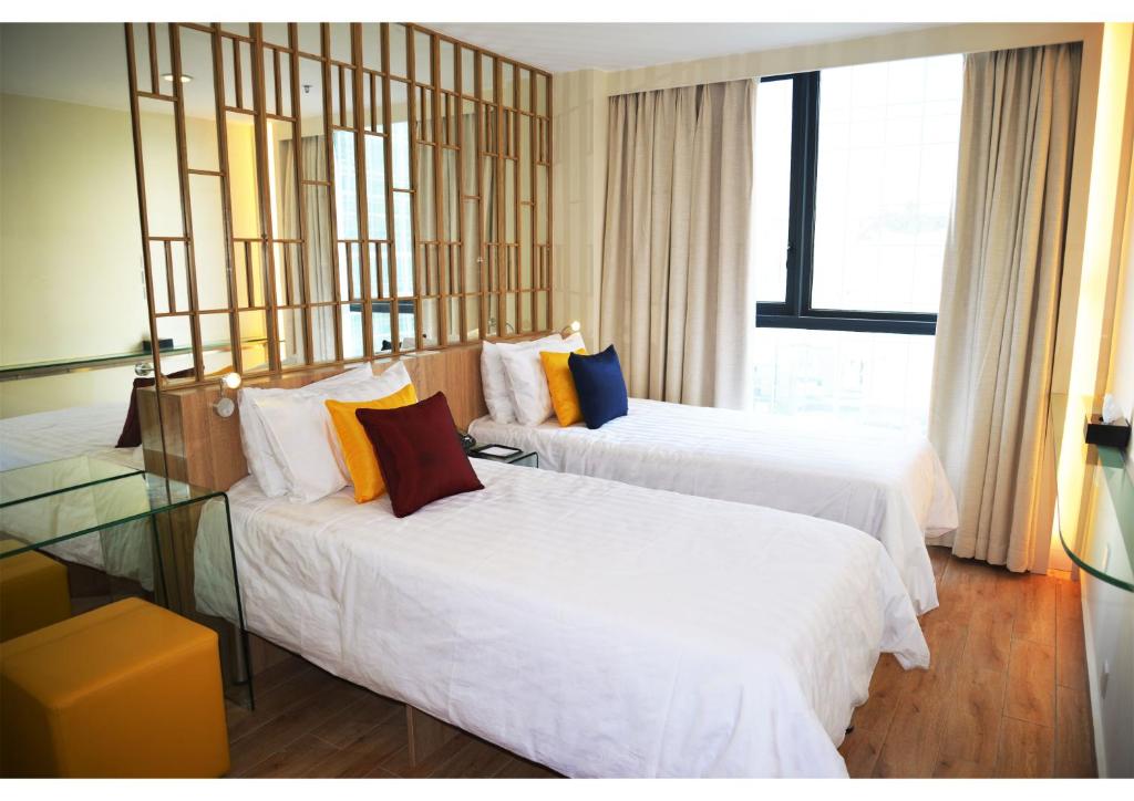 Voodi või voodid majutusasutuse IW Hotel toas