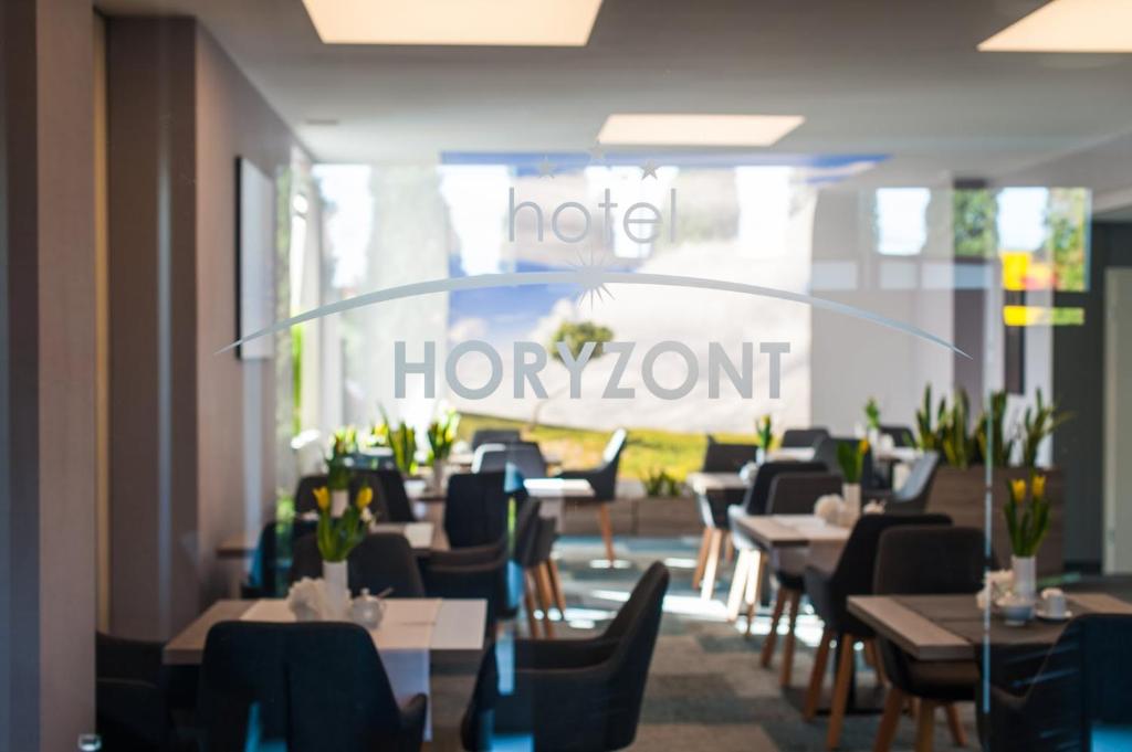 En restaurant eller et spisested på Hotel Horyzont