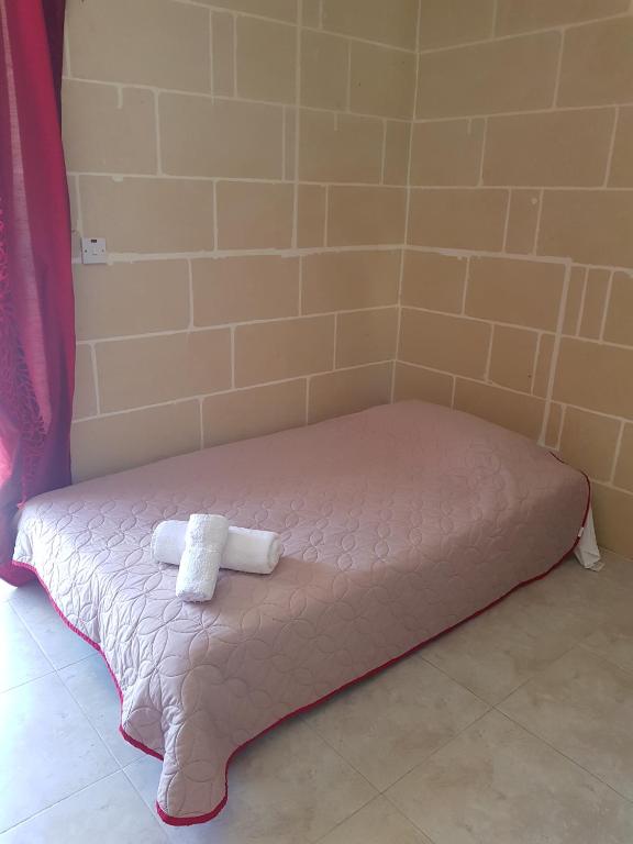 Postel nebo postele na pokoji v ubytování Palm Court Apartment