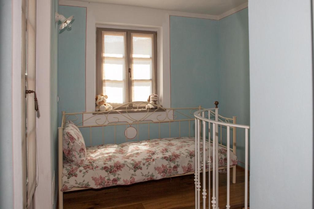 Postel nebo postele na pokoji v ubytování B&B I Corni di Nibbio