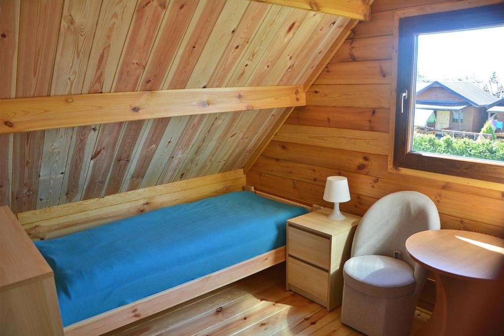 Llit o llits en una habitació de DorJan - Domki Letniskowe