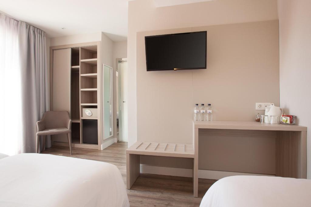 Postel nebo postele na pokoji v ubytování Hostal Centric