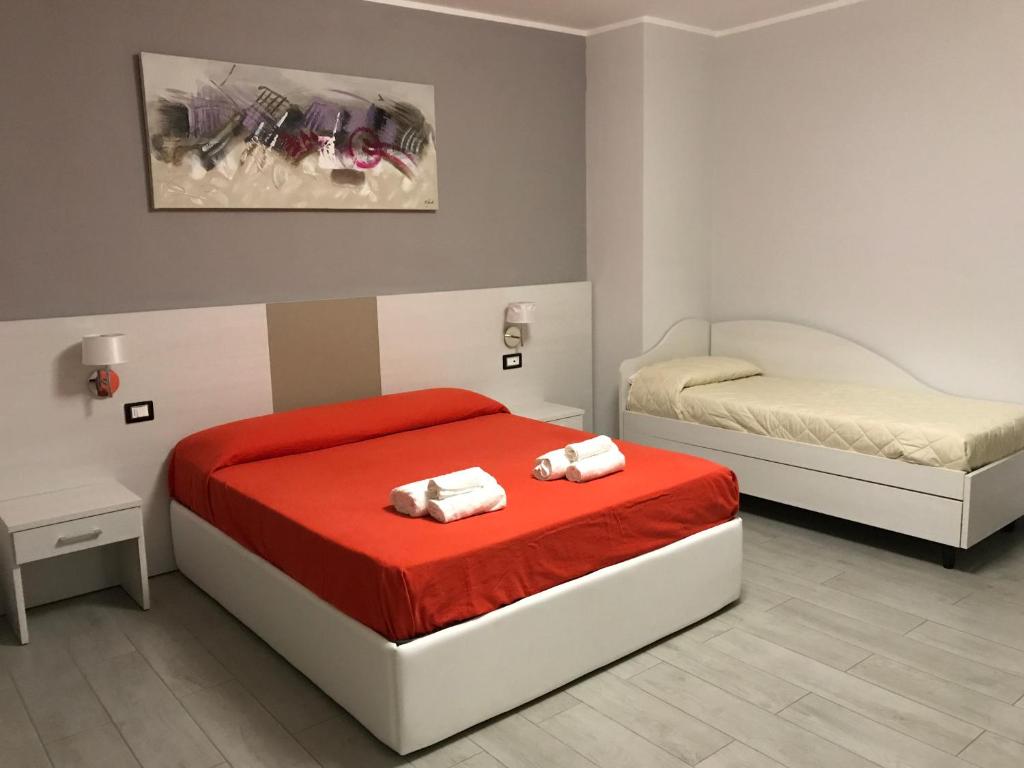Postel nebo postele na pokoji v ubytování Meublé Leonetti