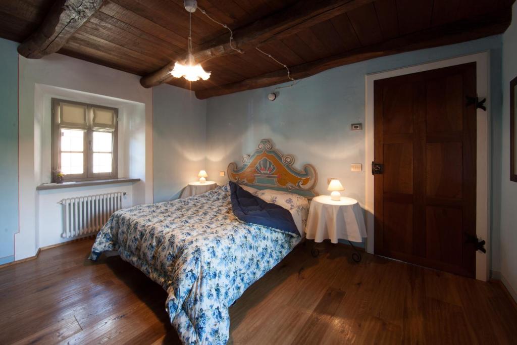 Postel nebo postele na pokoji v ubytování B&B I Corni di Nibbio