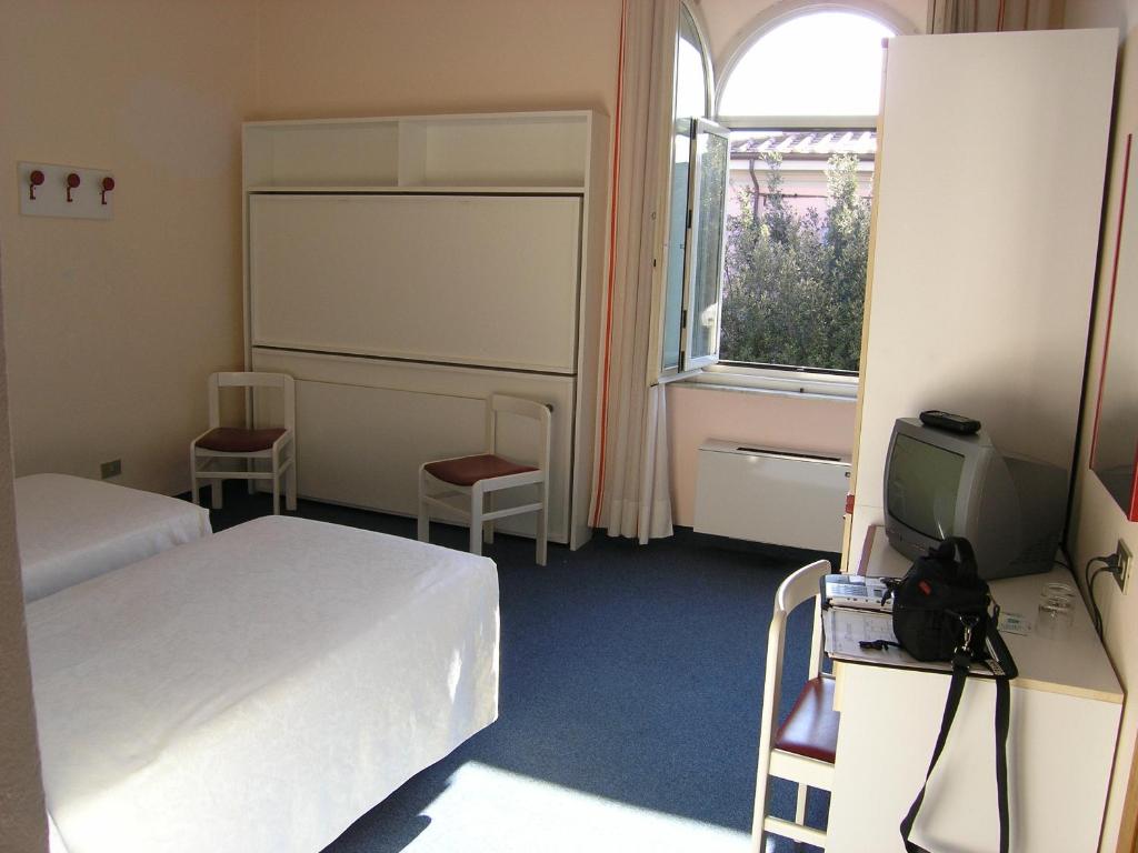 Postel nebo postele na pokoji v ubytování Elba Hotel