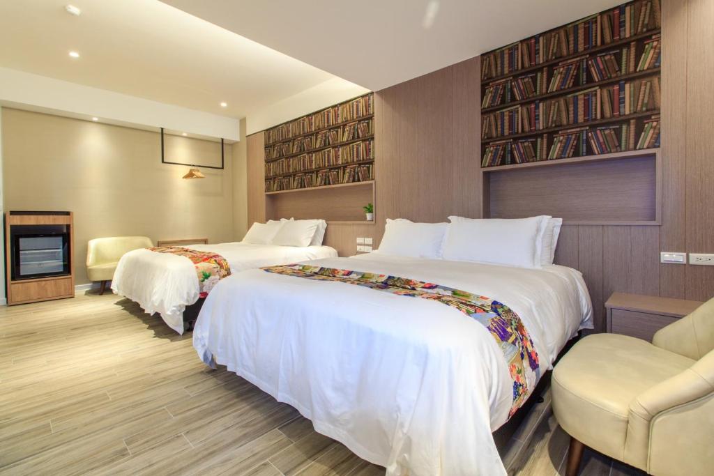 Postel nebo postele na pokoji v ubytování Urban Oasis Inn
