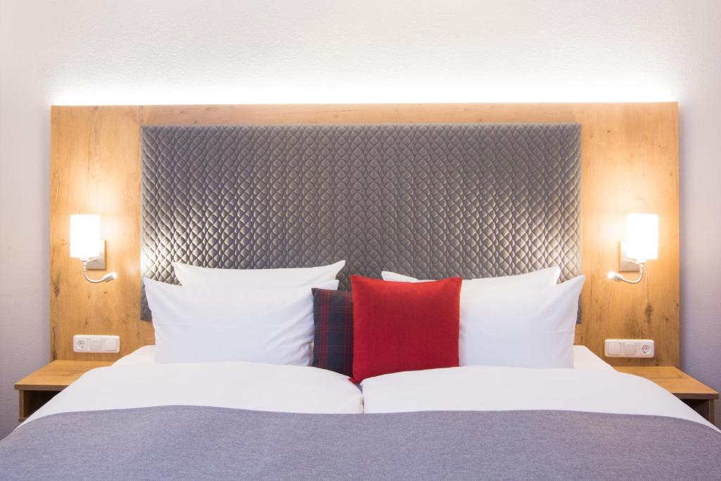 Postel nebo postele na pokoji v ubytování Genusshotel "Zum Wendl"