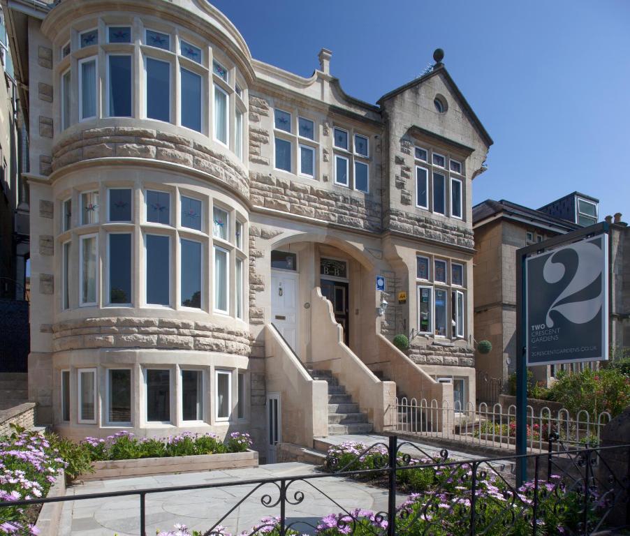 a house with a sign in front of it at 2 Crescent Gardens Guest House in Bath