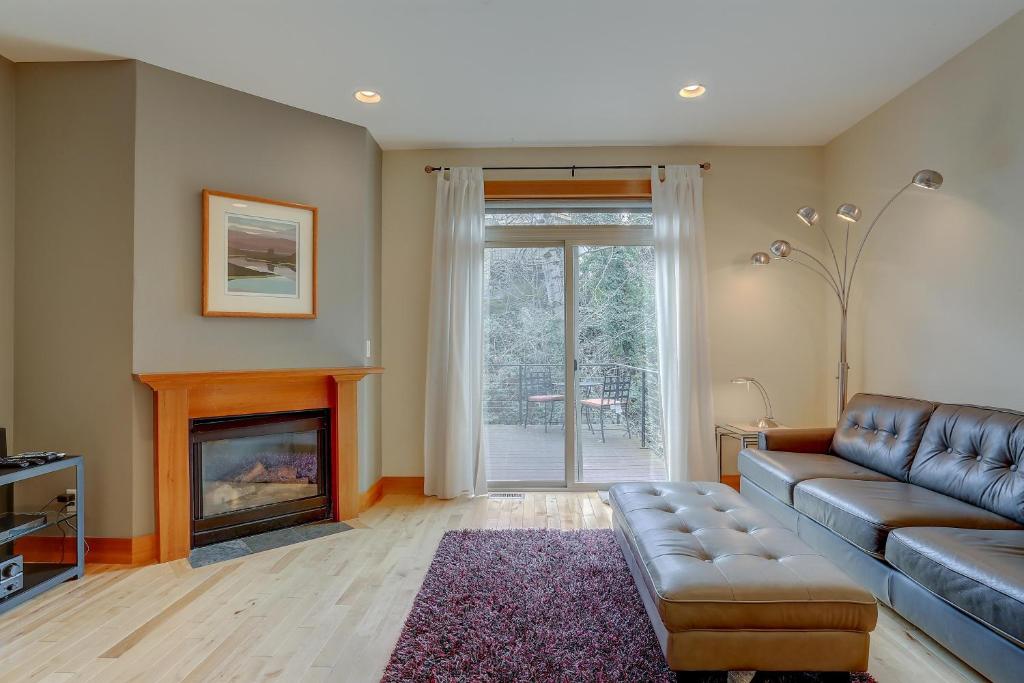 a living room with a couch and a fireplace at B2 30 day minimum in Hood River