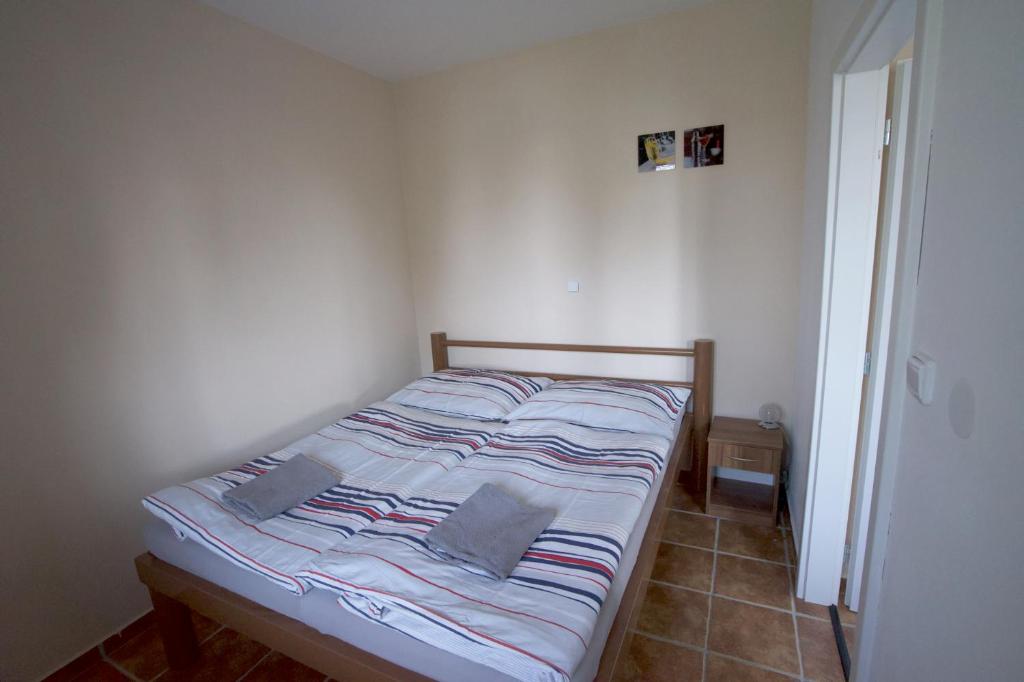 Postel nebo postele na pokoji v ubytování Penzion Rožmberk