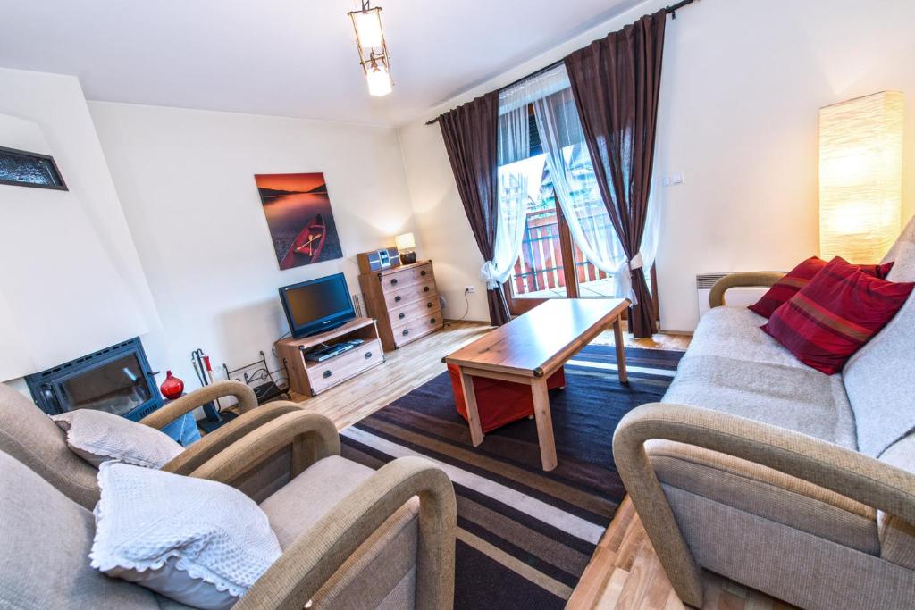 Posezení v ubytování Apartamenty Sun & Snow Pardałówka