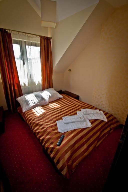 Postel nebo postele na pokoji v ubytování Dwa Bratanki