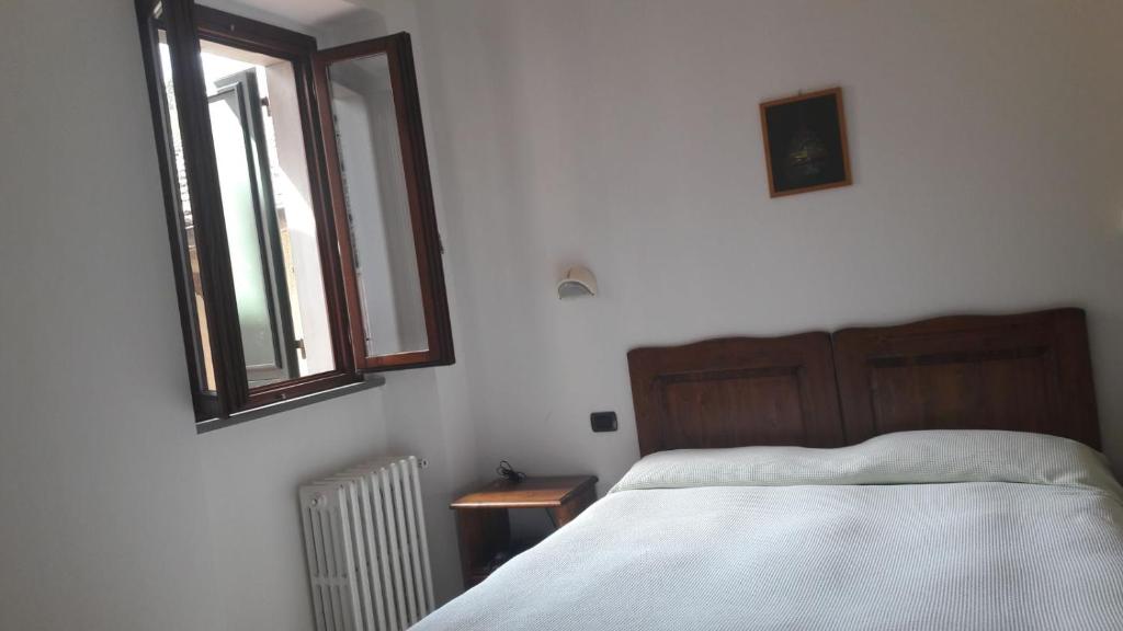 Łóżko lub łóżka w pokoju w obiekcie Acquacheta Valtancoli Hotel B&B