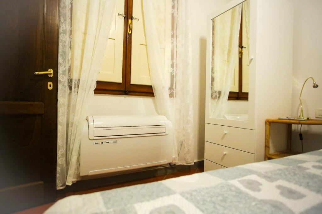 Posteľ alebo postele v izbe v ubytovaní Via Guelfa Apartment