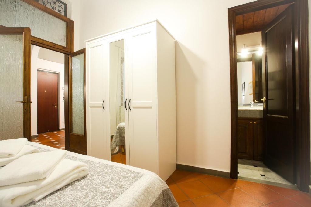Posteľ alebo postele v izbe v ubytovaní Via Guelfa Apartment