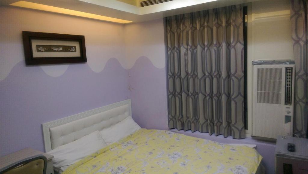 Кровать или кровати в номере 永春棧Kozzy Apartment