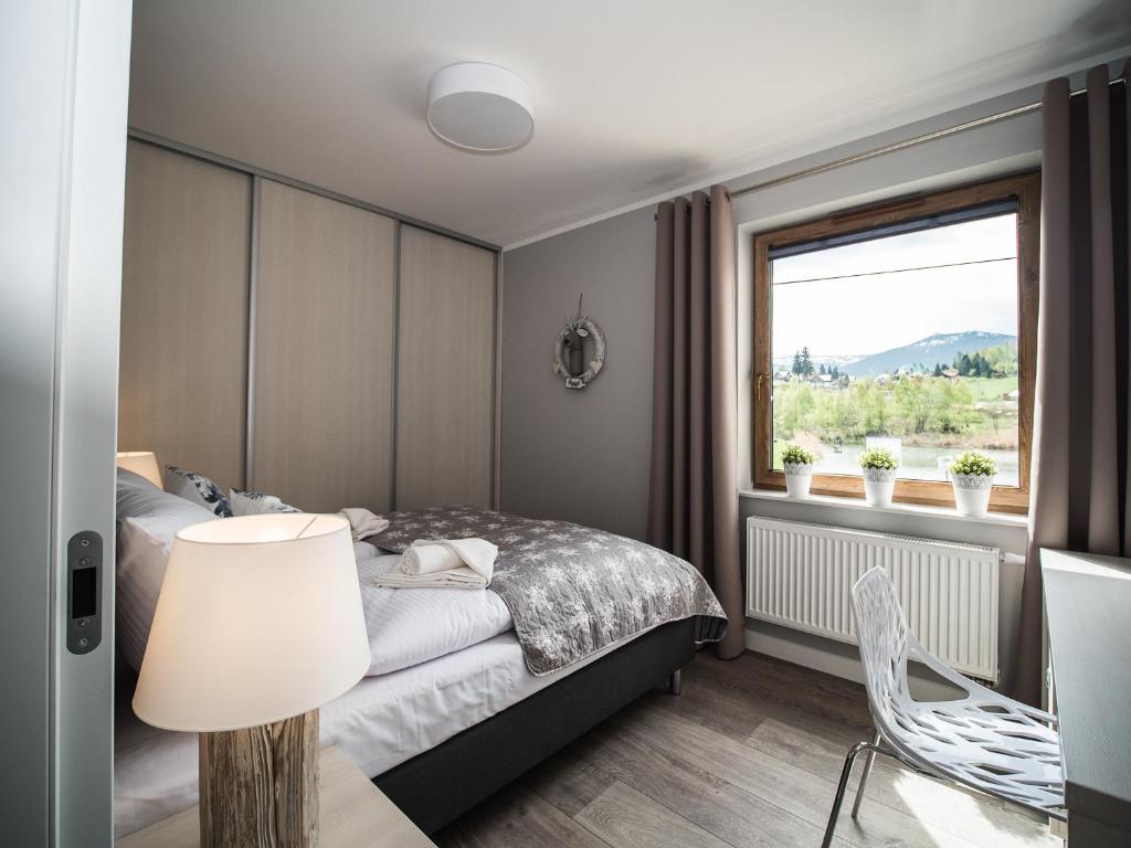 Posteľ alebo postele v izbe v ubytovaní Apartamenty Bawaria