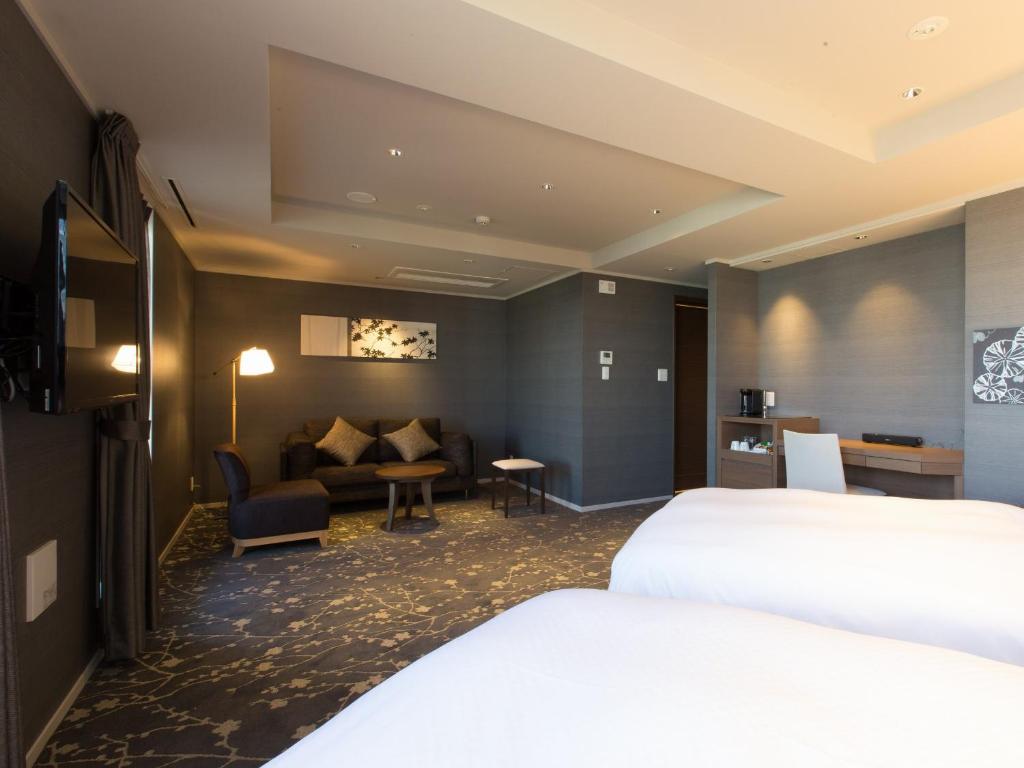 Postel nebo postele na pokoji v ubytování Hotel Shiki Utsubo Park