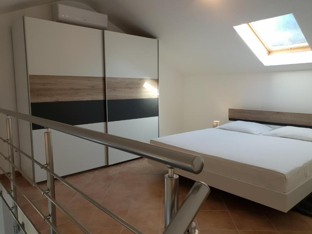 Posteľ alebo postele v izbe v ubytovaní Apartments Villa Maslinica
