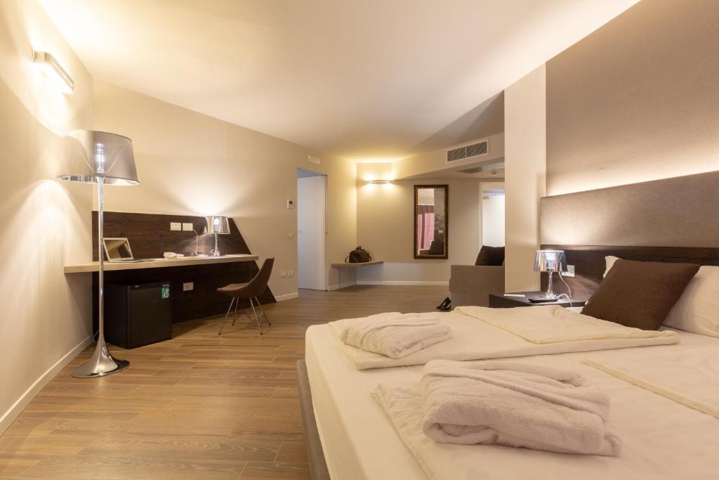 Postel nebo postele na pokoji v ubytování Pace 1954 Hotel