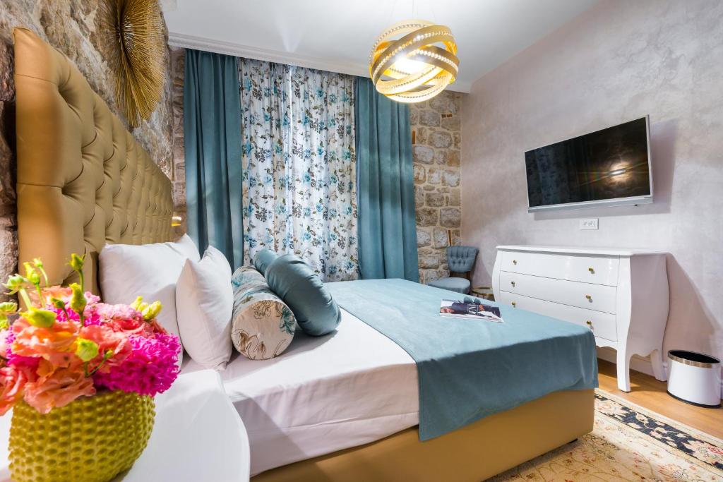 Postel nebo postele na pokoji v ubytování Dominus Rooms