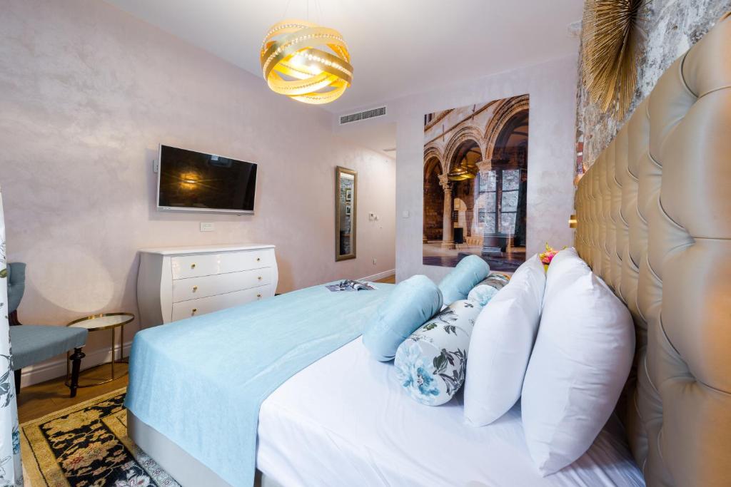 Postel nebo postele na pokoji v ubytování Dominus Rooms