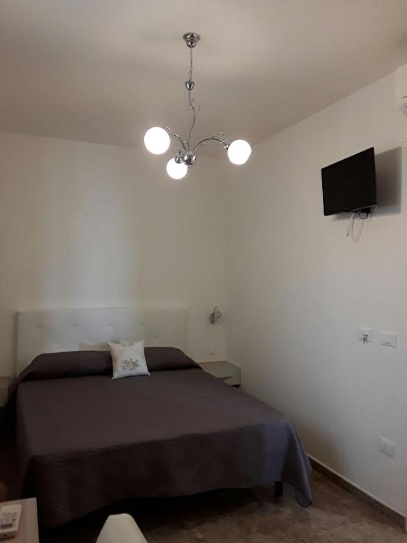 Postel nebo postele na pokoji v ubytování B&B Nonna Teresa