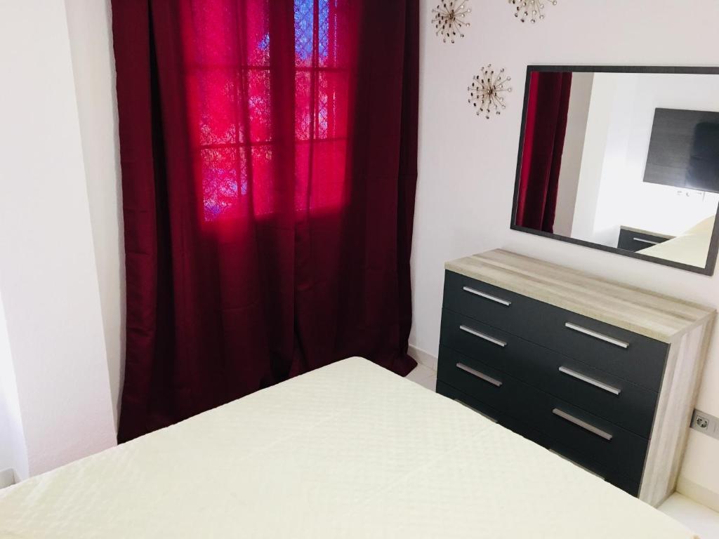 Postel nebo postele na pokoji v ubytování Apartamentos Las Haciendas Altamar