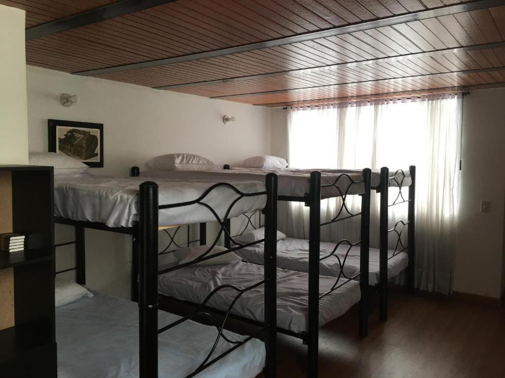 Postel nebo postele na pokoji v ubytování Casa hotel Sports and Family
