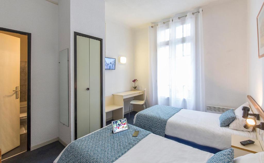 Postel nebo postele na pokoji v ubytování Hôtel Aneto