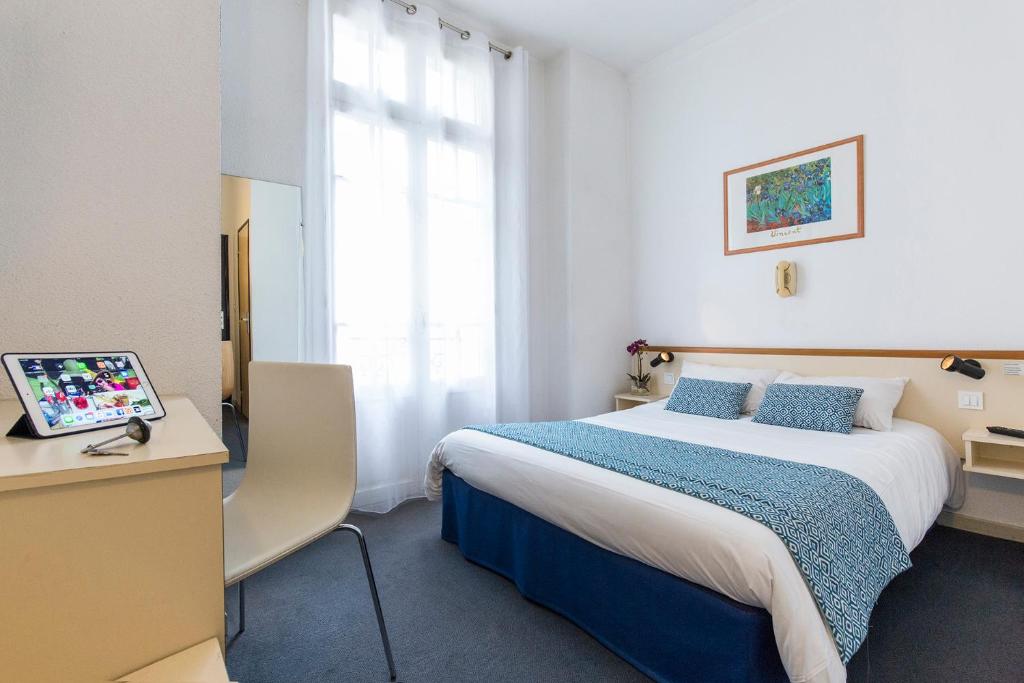 Postel nebo postele na pokoji v ubytování Hôtel Aneto