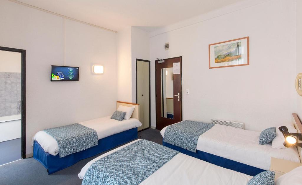 Postel nebo postele na pokoji v ubytování Hôtel Aneto
