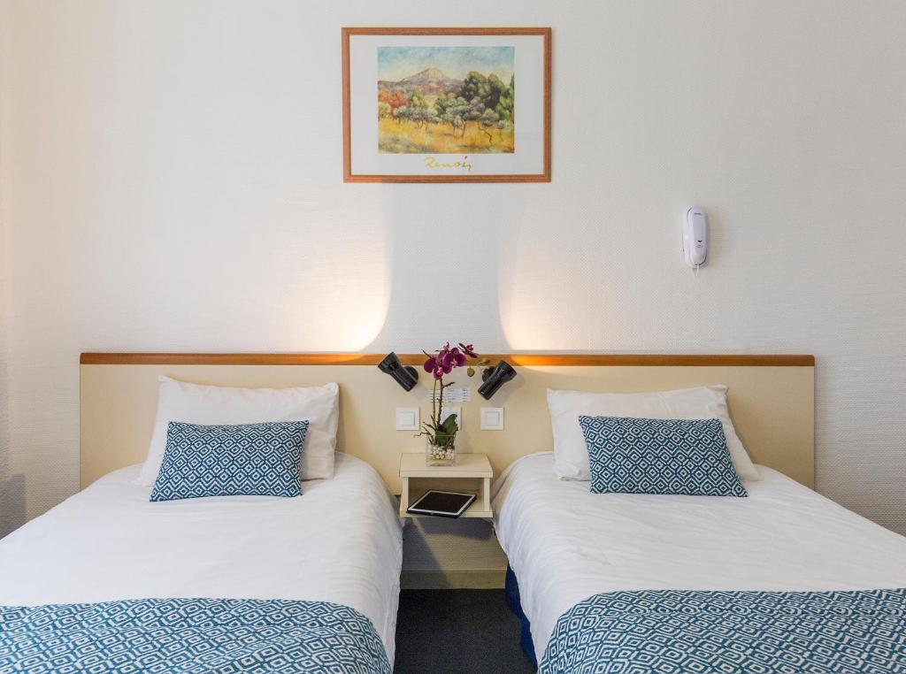 Postel nebo postele na pokoji v ubytování Hôtel Aneto