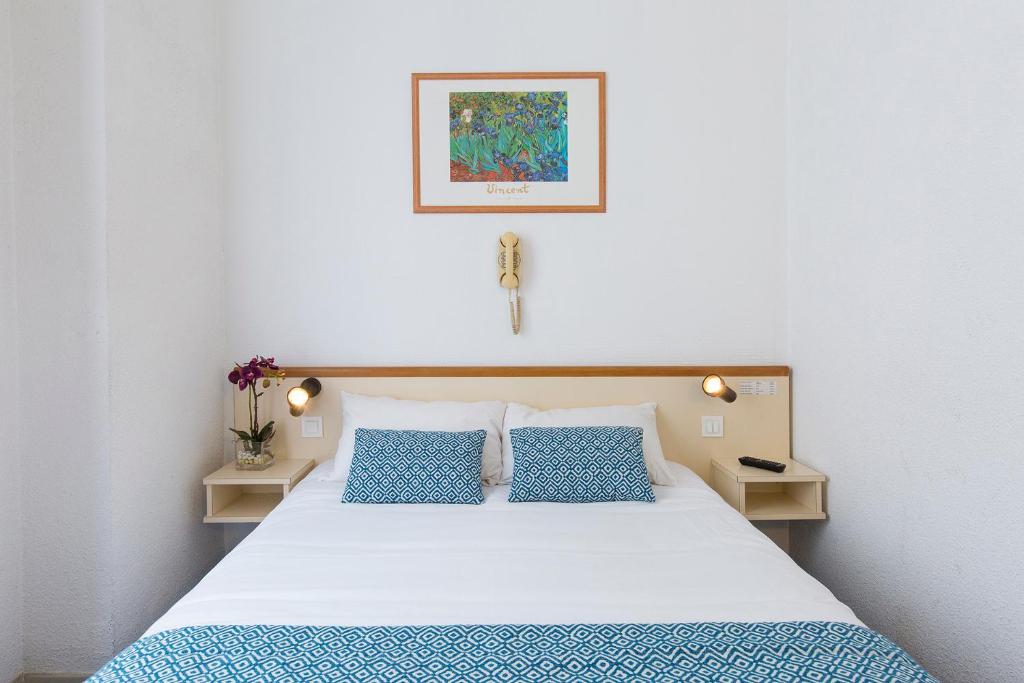 Postel nebo postele na pokoji v ubytování Hôtel Aneto