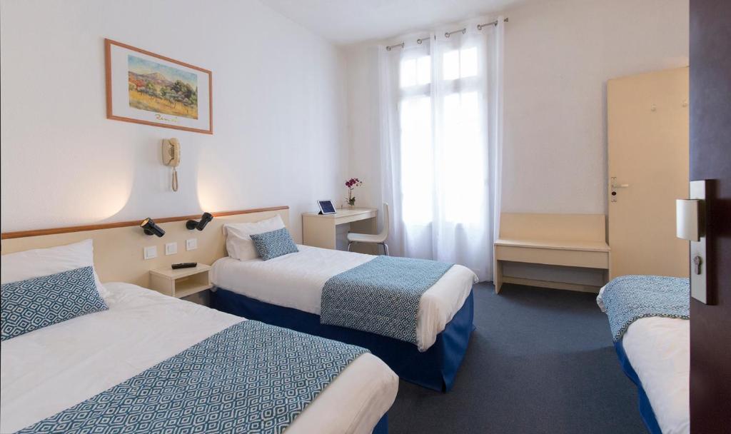 Postel nebo postele na pokoji v ubytování Hôtel Aneto