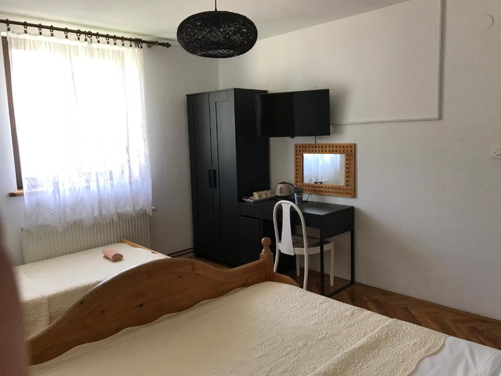 Posteľ alebo postele v izbe v ubytovaní Guest House Aurora