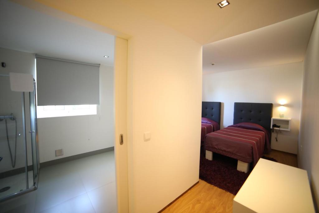 Postel nebo postele na pokoji v ubytování Hotel A Ponte