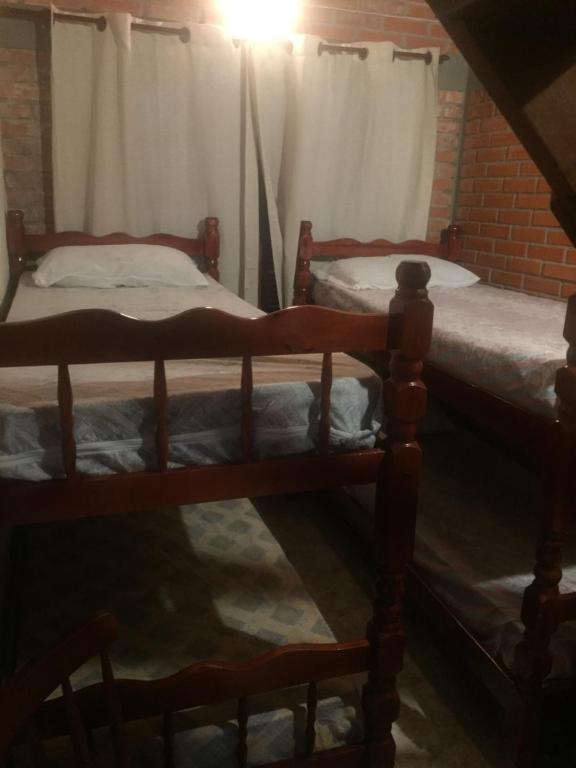 Postel nebo postele na pokoji v ubytování Cabañas Marcelo