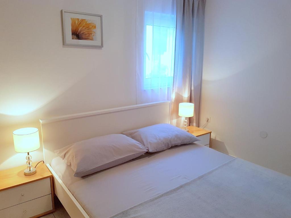 Posteľ alebo postele v izbe v ubytovaní Apartments Blu Mare
