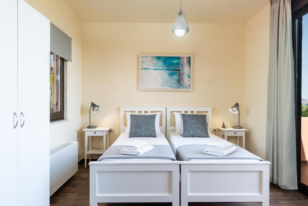 Łóżko lub łóżka w pokoju w obiekcie Villa Kudos
