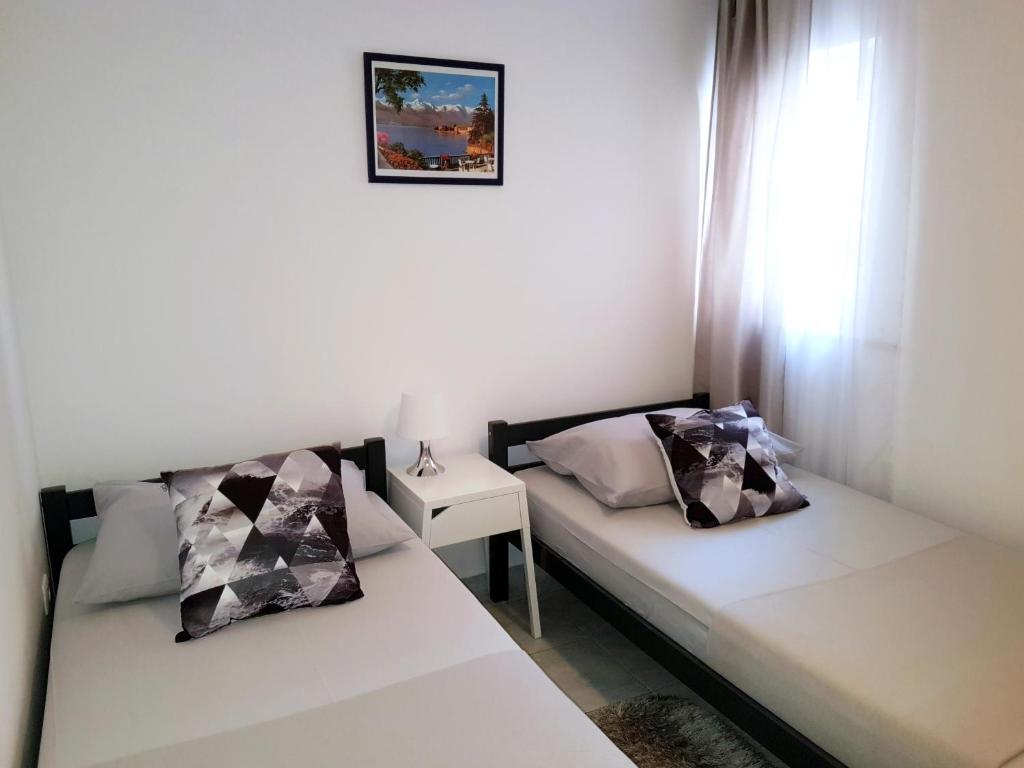 Posteľ alebo postele v izbe v ubytovaní Apartments Blu Mare