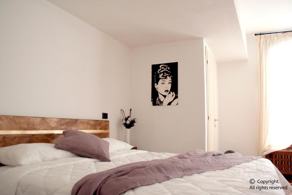 Кровать или кровати в номере Ai Sognatori