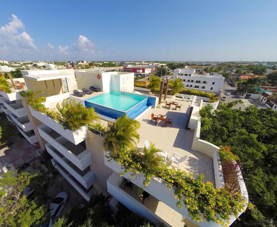 an aerial view of a building with a swimming pool at Angelo's Hotel in Playa del Carmen