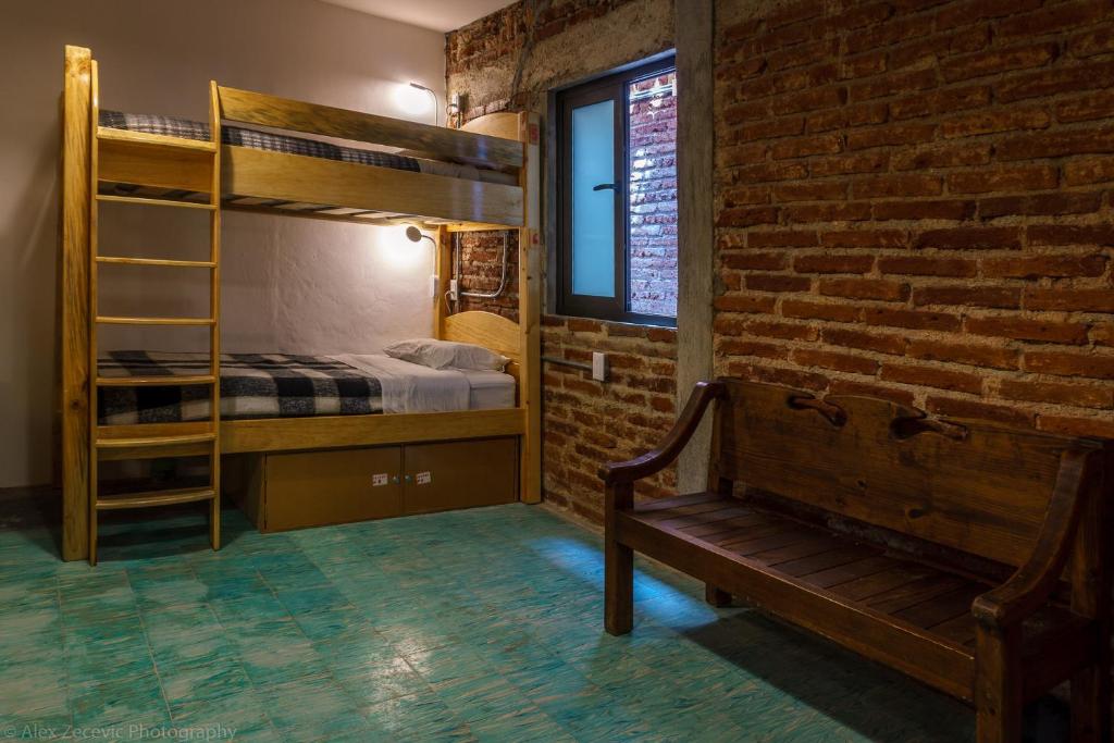 Postel nebo postele na pokoji v ubytování La Abuelita Hostal