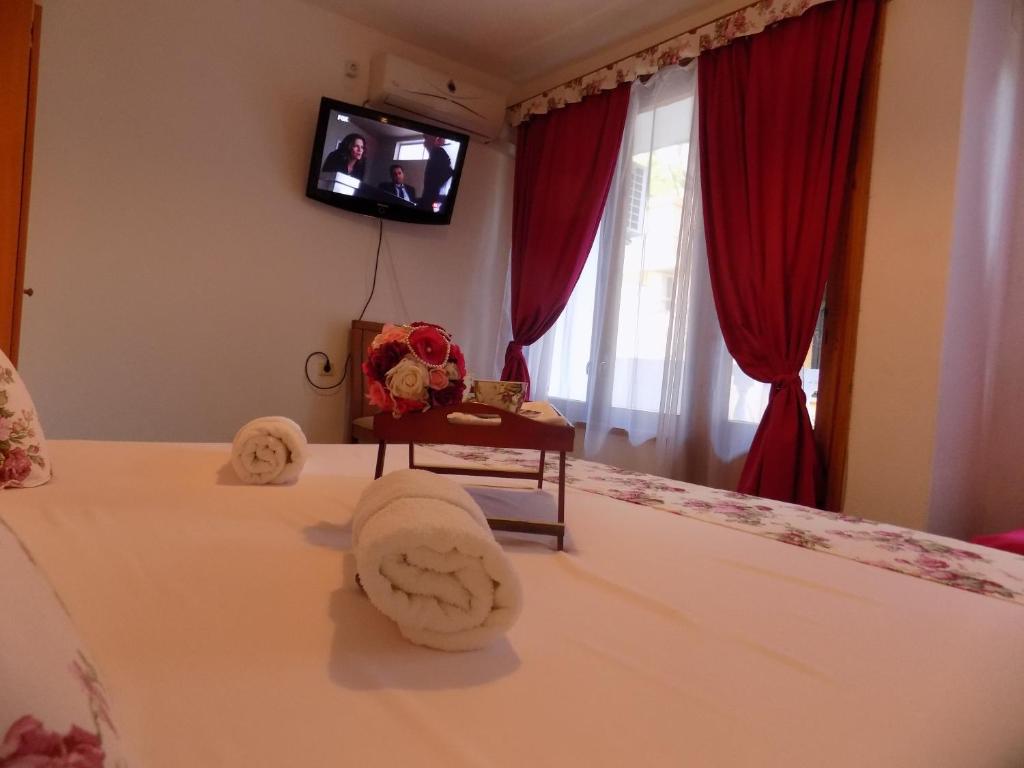 Postel nebo postele na pokoji v ubytování Rali Apartments